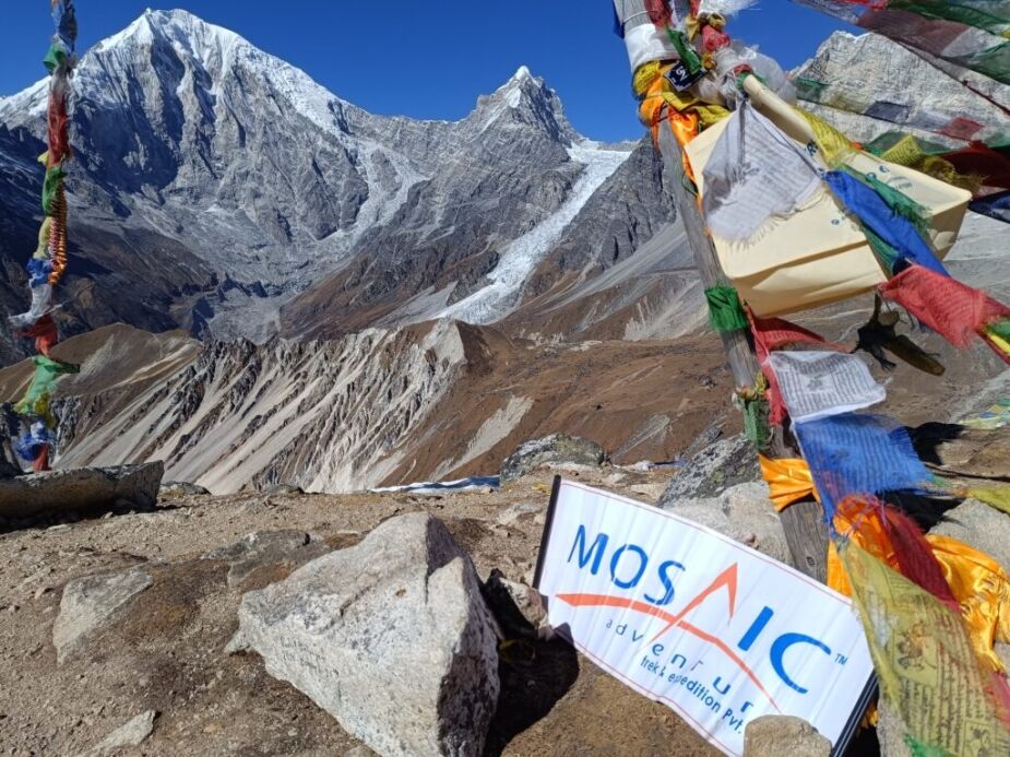 we are at top of tsergo ri with mosaic adventure sign