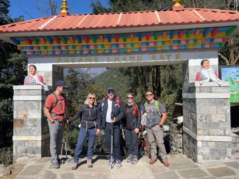 Trekkers posing at Pasang Lhamu Gate on the Everest Base Camp Trek route in Nepal
