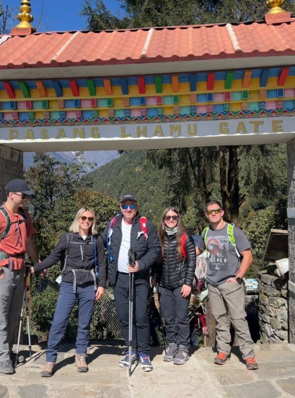 Trekkers posing at Pasang Lhamu Gate on the Everest Base Camp Trek route in Nepal