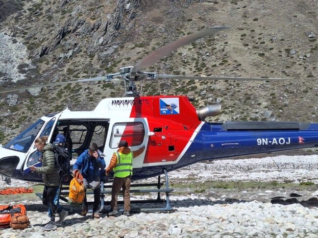 Riding helicopter to return to Kathmandu from Everest region as part of short trek to EBC