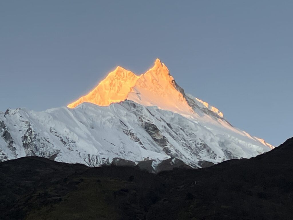 manaslu circuit trek golden sunrise over mountain