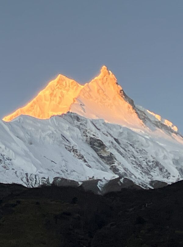 manaslu circuit trek golden sunrise over mountain