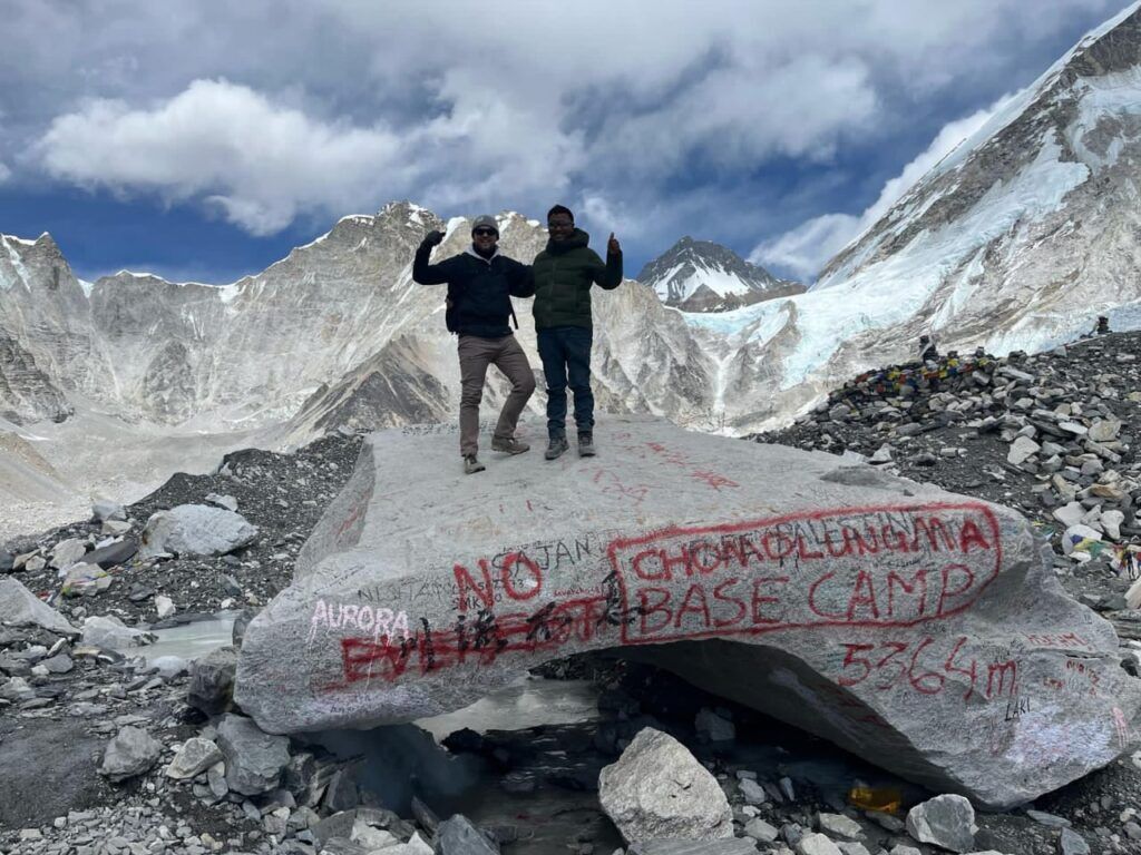 standing on ebc marked stone at 5364 meters